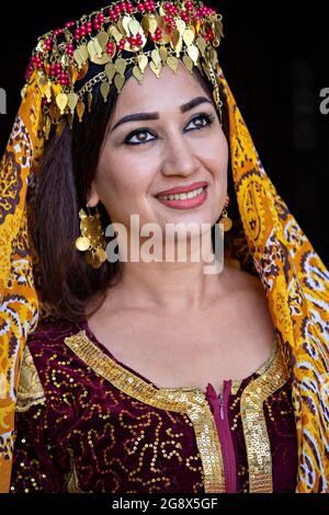 Portrait of Uzbek woman in traditional clothes in Khiva, Uzbekistan Stock Photo