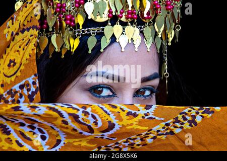 Portrait of Uzbek woman in traditional clothes in Khiva, Uzbekistan Stock Photo