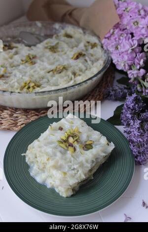 Gullac, ramadan dessert, on plate with bulk Stock Photo