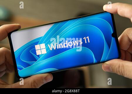 June 23, 2021. Barnaul, Russia. The logo of the new Windows 11 operating system on the smartphone. Stock Photo