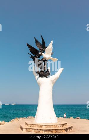 The Hand of Peace sculpture at the seafront in city centre of Kusadasi in Turkey. Stock Photo