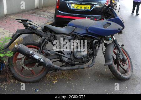 Mumbai Maharashtra India Asia March 09 2020  Old discarded rusty motorcycle standing on a  close to the town very bright and colorful Stock Photo