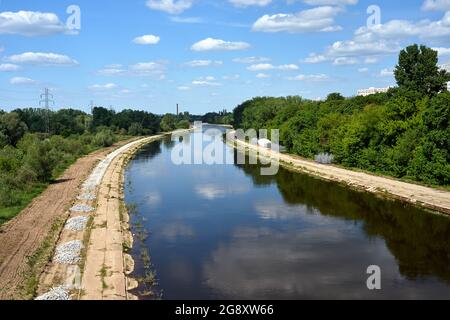 deciduous forest and the wide-spread Warta River in Poland Stock Photo