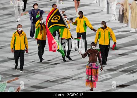 Vanuatu flagbearer Riilio Rii leads the team out during the opening ceremony of the Tokyo 2020 Olympic Games at the Olympic Stadium in Japan. Picture date: Friday July 23, 2021. Stock Photo