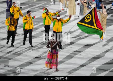 Vanuatu flagbearer Riilio Rii leads the team out during the opening ceremony of the Tokyo 2020 Olympic Games at the Olympic Stadium in Japan. Picture date: Friday July 23, 2021. Stock Photo