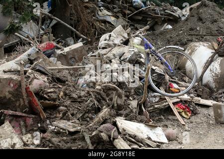 Bad Neuenahr Ahrweiler, Germany. 22nd July, 2021. Bulky waste lies by the roadside with a bicycle sticking out of it. The clean-up work in the flooded area is in full swing. Credit: Bodo Marks/dpa/Alamy Live News Stock Photo
