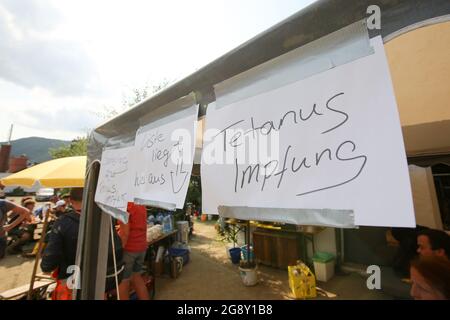 Bad Neuenahr Ahrweiler, Germany. 22nd July, 2021. At a supply stand, possible tetanus vaccinations are pointed out. The clean-up work in the flooded area is in full swing. Credit: Bodo Marks/dpa/Alamy Live News Stock Photo
