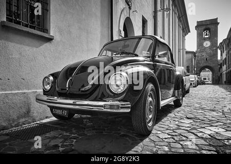 San Giovanni in Marignano, Italy - February 29, 2020:  Vintage car Volkswagen Beetle 1303 Cabriolet (1972—1980) parked in the street in old italian to Stock Photo