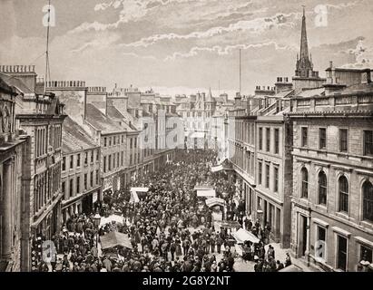 A late 19th century view of 'Feeing Saturday' in Arbroath,  a former royal burgh and the largest town in the council area of Angus, Scotland. The Feeing Market was held four times a year, during which the streets were thronged with employers and servants seeking employment. Stock Photo