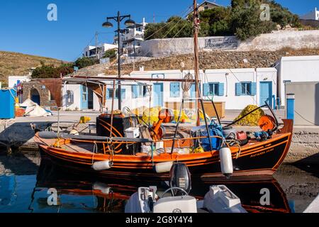 LOUTRA, Kythnos, Greece, 03.06.2019. Colorful old wooden fishing boat moored at the pier in Loutra Marina Kythnos, Cyclades Islands. Stock Photo