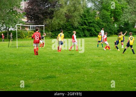 Boys teams playing football on Saturday morning in  UK Great Britain  2021 KATHY DEWITT Stock Photo