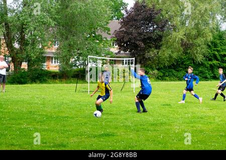 Boys teams playing football on Saturday morning in Wales UK Great Britain  2021 KATHY DEWITT Stock Photo