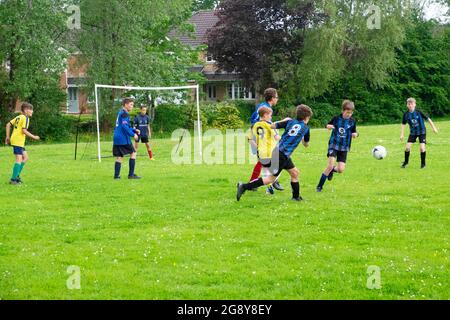 Boys teams playing football on Saturday morning in UK Great Britain  2021 KATHY DEWITT Stock Photo