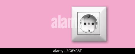 House electricity and outlet concept background and banner, EU electric socket on a pink wall, copy space Stock Photo