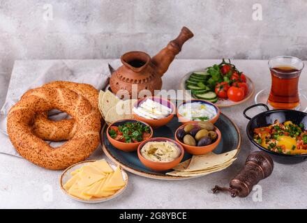 Traditional Turkish breakfast with meze and simit