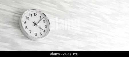 Classic round clock on gray wall in modern home house interior design, banner with copy space, concept of time management Stock Photo