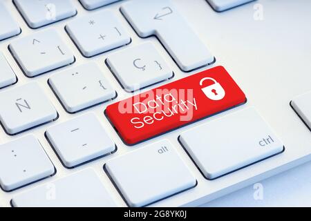 Cyber Security word and padlock icon on red computer keyboard Stock Photo