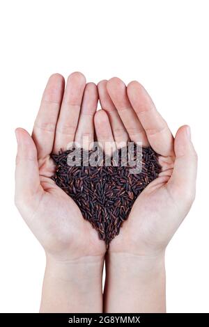 Organic rice heart-shaped on palm of asian woman hand, isolated on white background Stock Photo