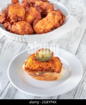 Nashville Hot Chicken covered in cayenne pepper sauce Stock Photo