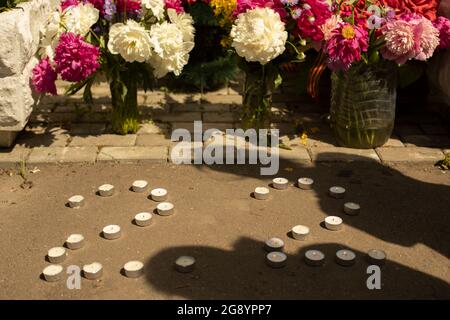 Lighting candles. Memorial fire. Candles on the monument. Victory Day in World War II. Stock Photo