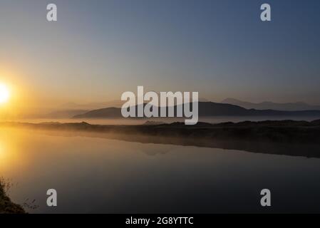 Beautiful sunrise over the Erciyes mountain and river in a misty morning in Kayseri