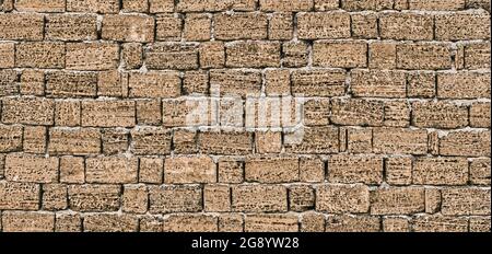 Wall from a handmade brick from shell rock Stock Photo