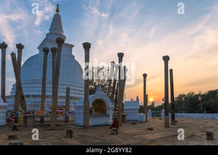 Evening sunset on the territory of the ancient Buddhist temple of Thuparama Dagoba. Anuradhapura, Sri Lanka Stock Photo