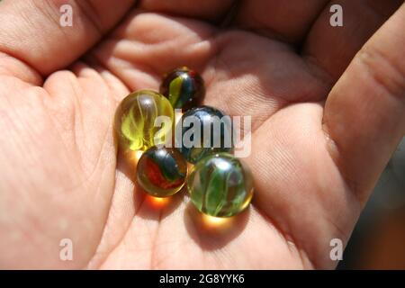 Kids Marbles. Colorful glass made Marbles. Glass Marbles. Stock Photo