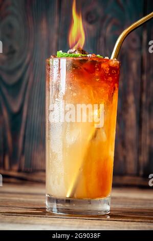 Glass of Holy water cocktail on the wooden background Stock Photo