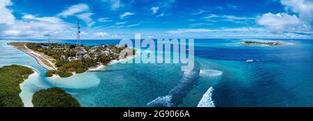 Thulusdhoo Island amidst blue sea at Kaafu atoll, Maldives Stock Photo