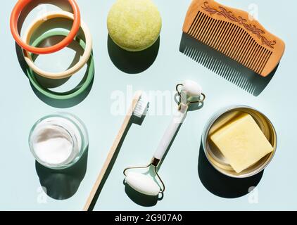 Studio shot of wooden comb, bamboo toothbrush, colorful bracelets, organic soap, shampoo and other eco-friendly self-care products Stock Photo