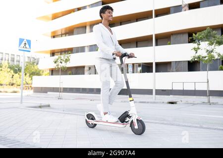 Businesswoman Is Riding Push Scooter In Park She Fell And Twisted Her Ankle Stock Photo Alamy