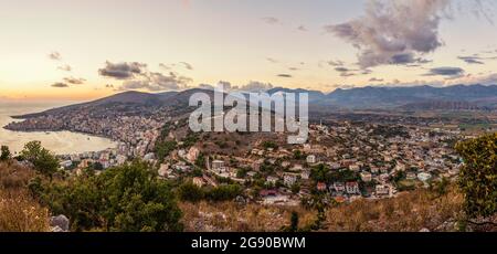 Albania, Vlore County, Sarande, City on Ionian coast at dusk Stock Photo