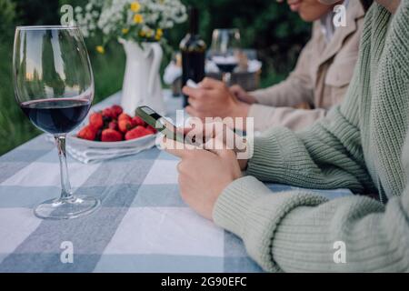 Young couple using smart phones at table Stock Photo