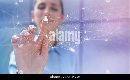 Businesswoman touching social network connection on digital display Stock Photo
