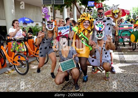 February 16, 2020: Friends in costumes perform during the Carnival street party in Rio de Janeiro. Carnival is one of the most chief events of Brazil. Stock Photo