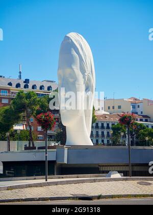 Julia, a sculpture by Jaume Plensa over the Centro Cultural de la Villa Theater (Fernan Gomez). Madrid, Spain. Stock Photo