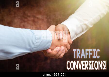 Handwriting text Traffic Conversions. Business approach visitor who has been converted into a client or customer Two Professional Well-Dressed Stock Photo