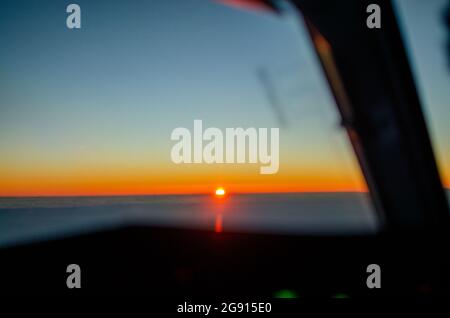sunrise from the cockpit of an airline plane Stock Photo