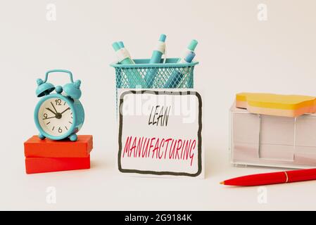 Text caption presenting Lean Manufacturing. Word for focus on minimizing waste within manufacturing systems Tidy Workspace Setup Writing Desk Tools Stock Photo