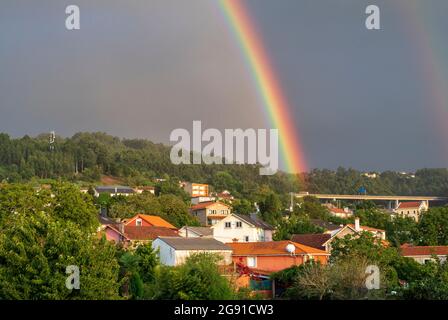 Spectacular and Colorful Rainbow Over Galician Town of Fene Spain Stock Photo