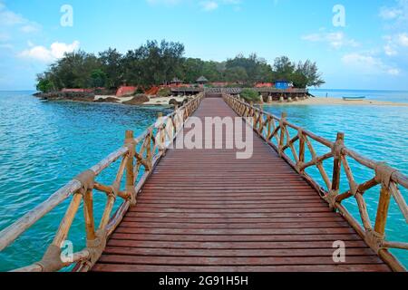 Wooden dock walkway to a small, idyllic tropical island, Zanzibar Stock Photo