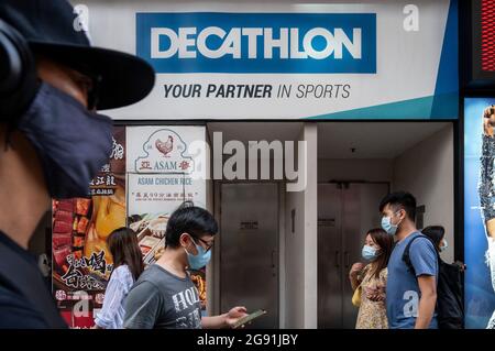 Pedestrians walk past the French sporting goods Decathlon and Australia's  largest clothing retailer Cotton On stores in Hong Kong. (Photo by Budrul  Chukrut / SOPA Images/Sipa USA Stock Photo - Alamy