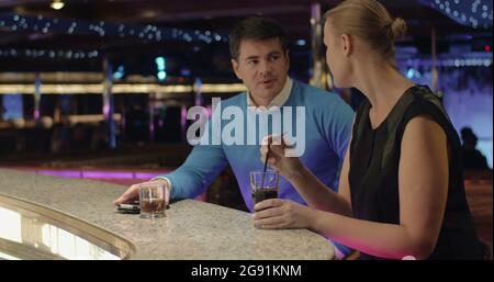 Young people talking and having drinks in the bar Stock Photo
