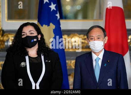 Tokyo, Japan. 24th July, 2021. Japanese Prime Minister Yoshihide Suga (R) poses with Vjosa Osmani-Sadriu, President of the Republic of Kosovo, ahead of their meeting at the Akasaka State Guest House in Tokyo, Japan, 24 July 2021. Prime Minister Suga is meeting foreign dignitaries visiting Japan for the Tokyo Olympics and Paralympics Games. (Credit Image: © POOL via ZUMA Press Wire) Credit: ZUMA Press, Inc./Alamy Live News Stock Photo