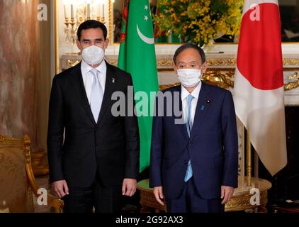 Tokyo, Japan. 24th July, 2021. Japanese Prime Minister Yoshihide Suga (R) poses with Serdar Berdymuhamedov, Deputy Chairman of the Cabinet of Ministers of Turkmenistan, ahead of their meeting at the Akasaka State Guest Hous''‹e in Tokyo, Japan, 24 July 2021. (Credit Image: © POOL via ZUMA Press Wire) Credit: ZUMA Press, Inc./Alamy Live News Stock Photo