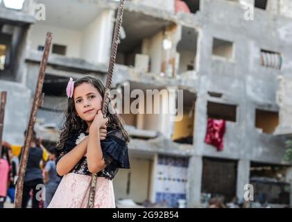 Gaza City, Palestine. 22nd July, 2021. A girl seen outside her house that was destroyed by Israeli air strikes on the town of Beit Hanoun. Credit: SOPA Images Limited/Alamy Live News Stock Photo