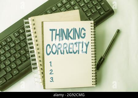 Hand writing sign Thinking Correctly. Business overview principle that you think are sensible and morally correct Two Plain Lined Spiral Notebooks Stock Photo