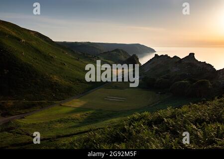 Low late summer sunlight over the Valley of Rocks, Lynton. Devon Stock Photo