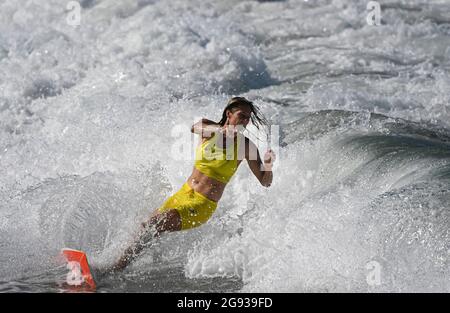 Chiba, Japan. 24th July, 2021. Stephanie Gilmore of Australia rides a wave during a training session at Tsurigasaki beach in Chiba, Japan, July 24, 2021. Credit: Du Yu/Xinhua/Alamy Live News Stock Photo